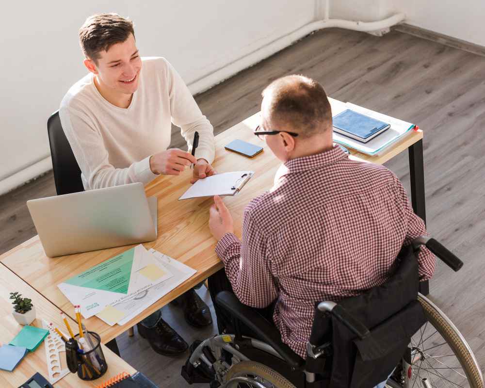 disabled-worker-filling-papers-contract-1-1_11zon https://nshopedisabilityservices.com.au/wp-content/uploads/2025/08/disabled-worker-filling-papers-contract-1-1_11zon.jpg